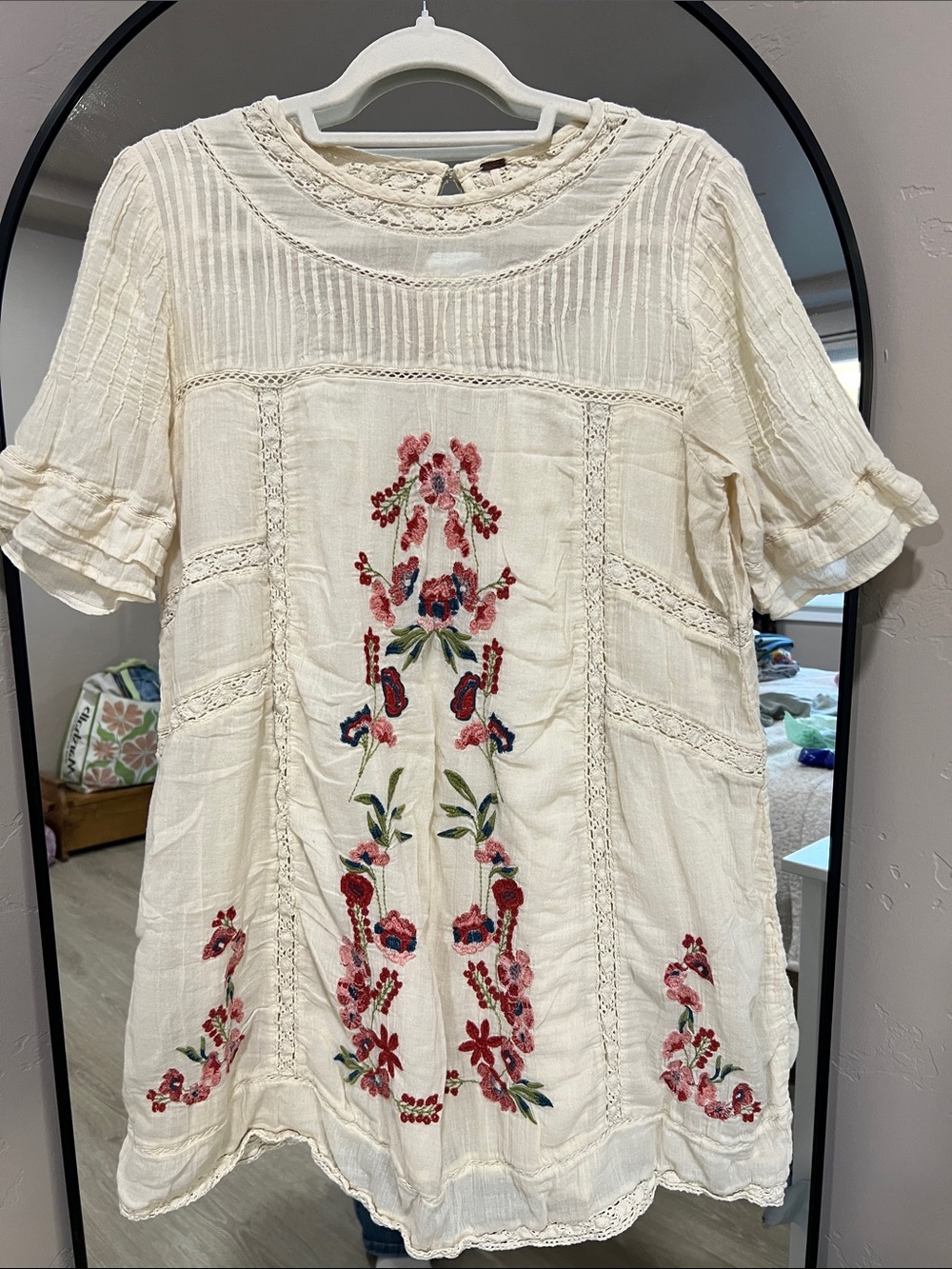 Free People Cream Mini Dress with Red, Pink, and Green Floral Embroidery.